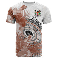 White Fiji-style masi T-shirt with brown floral print and FIJIAN emblem on chest