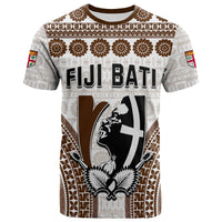 Rugby-style T-shirt, white with brown tapa pattern, 'FIJI BATI' and crest graphic on front.