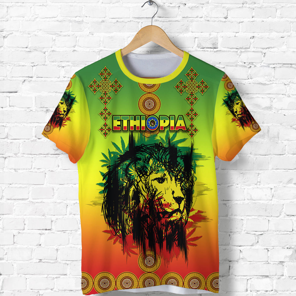 Hanging t-shirt front: green-yellow-red gradient with Ethiopia print, lion portrait, red cross icons.