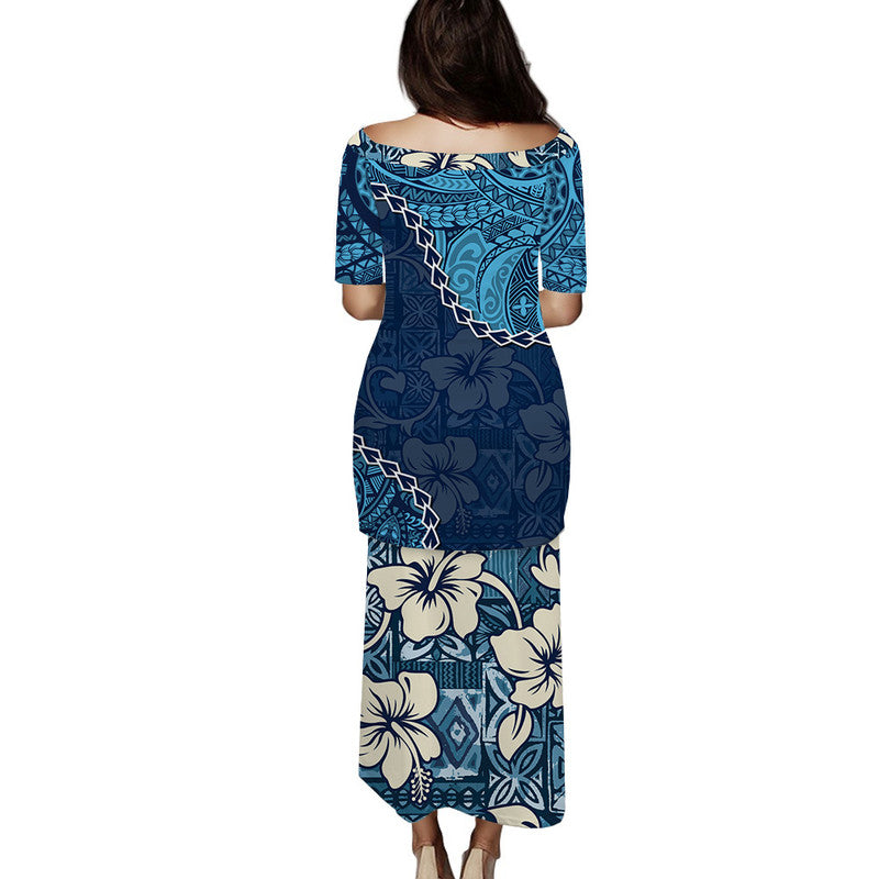 Blue long dress with wide neckline and 3/4 sleeves, tapa-style floral and geometric print