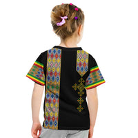 Kids black T‑shirt back view with colorful geometric panels and gold cross design