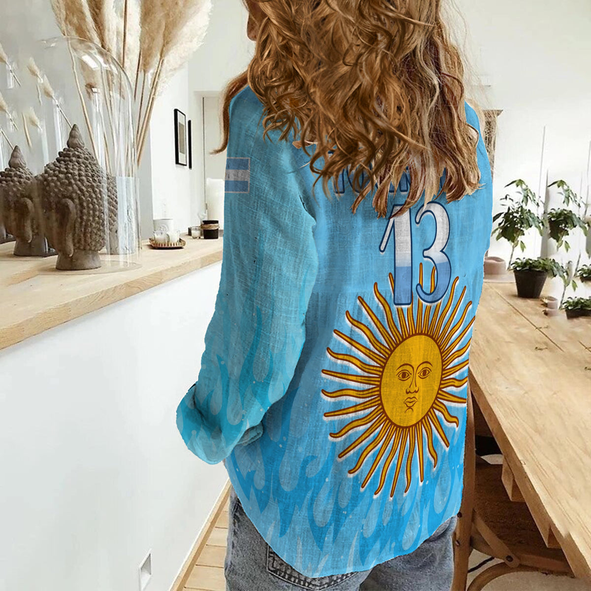 Women’s sky-blue Argentina football shirt back with sun face graphic and number 13