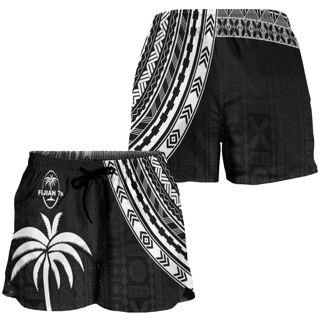 Women’s black rugby sevens shorts with white tapa-style border and patterned side panel
