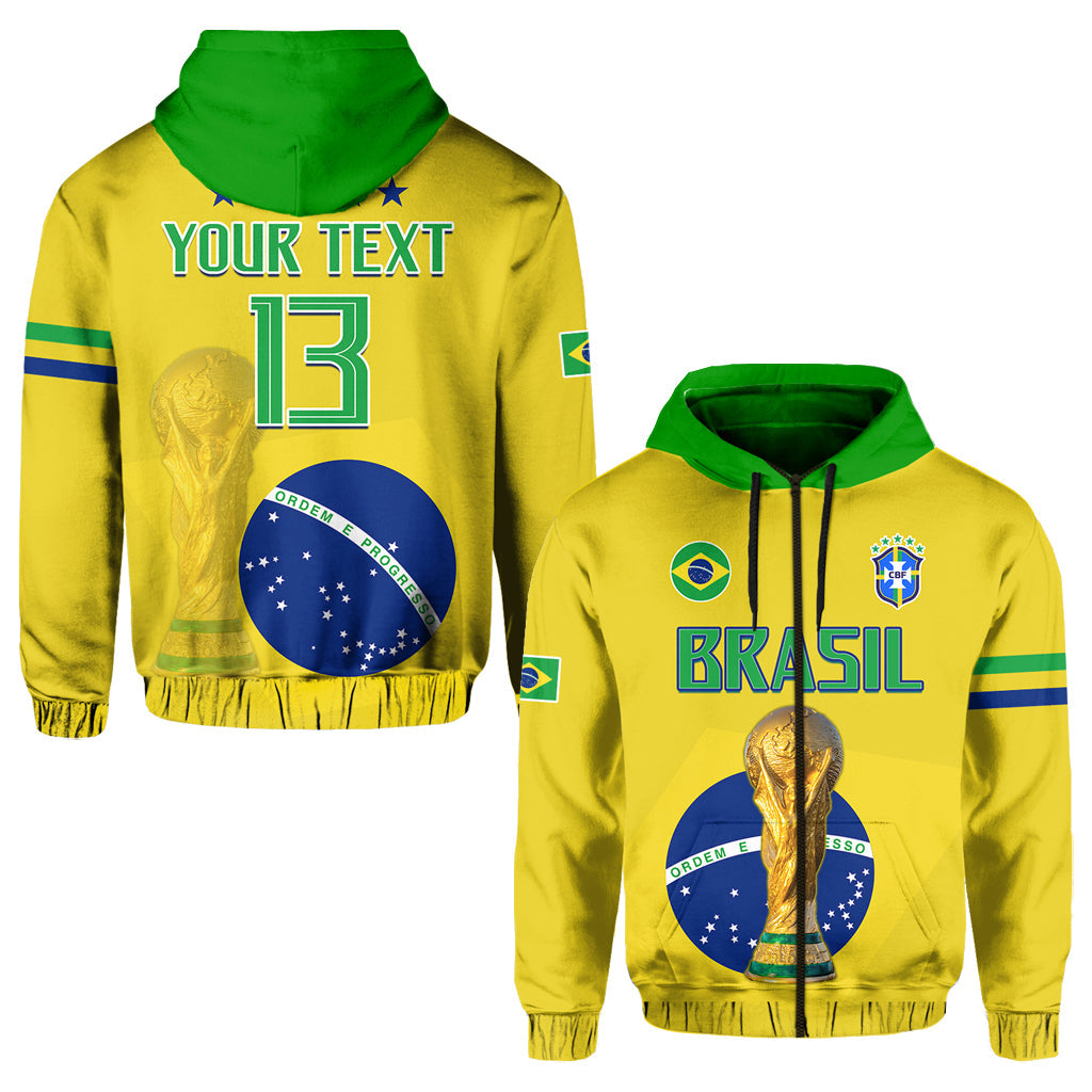 Yellow Brazil football hoodie with green hood, Brasil lettering, and gold trophy on chest.