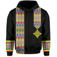 Black zip hoodie with patterned vertical panels and gold emblem at chest