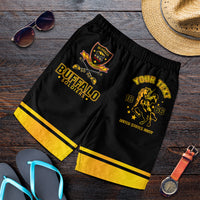 Men's black and yellow athletic shorts with gold graphic print and elastic waistband