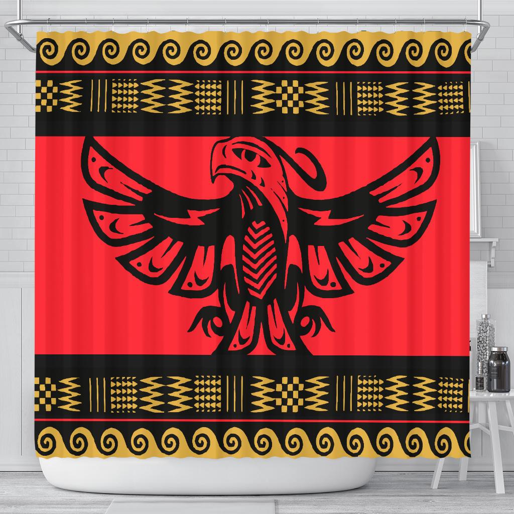 Red shower curtain with bold black bird emblem and gold tribal borders