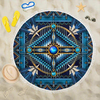 Blue mandala beach blanket with white fringe and circular geometric pattern