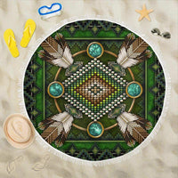 Green round beach blanket with beaded mandala graphic and white fringe edge