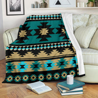 Teal Aztec pattern blanket with black, tan, and light-blue geometric bands