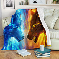 Ice Fire Wolf blanket with blue-and-orange wolf faces, draped over couch back