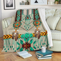 Multicolor breastplate-style blanket with teal beadwork, feather motifs, and tassels