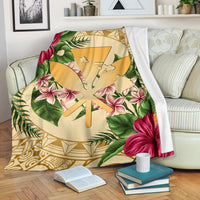 Gold tropical blanket with hibiscus, plumeria, palm leaves, and geometric pattern in gold