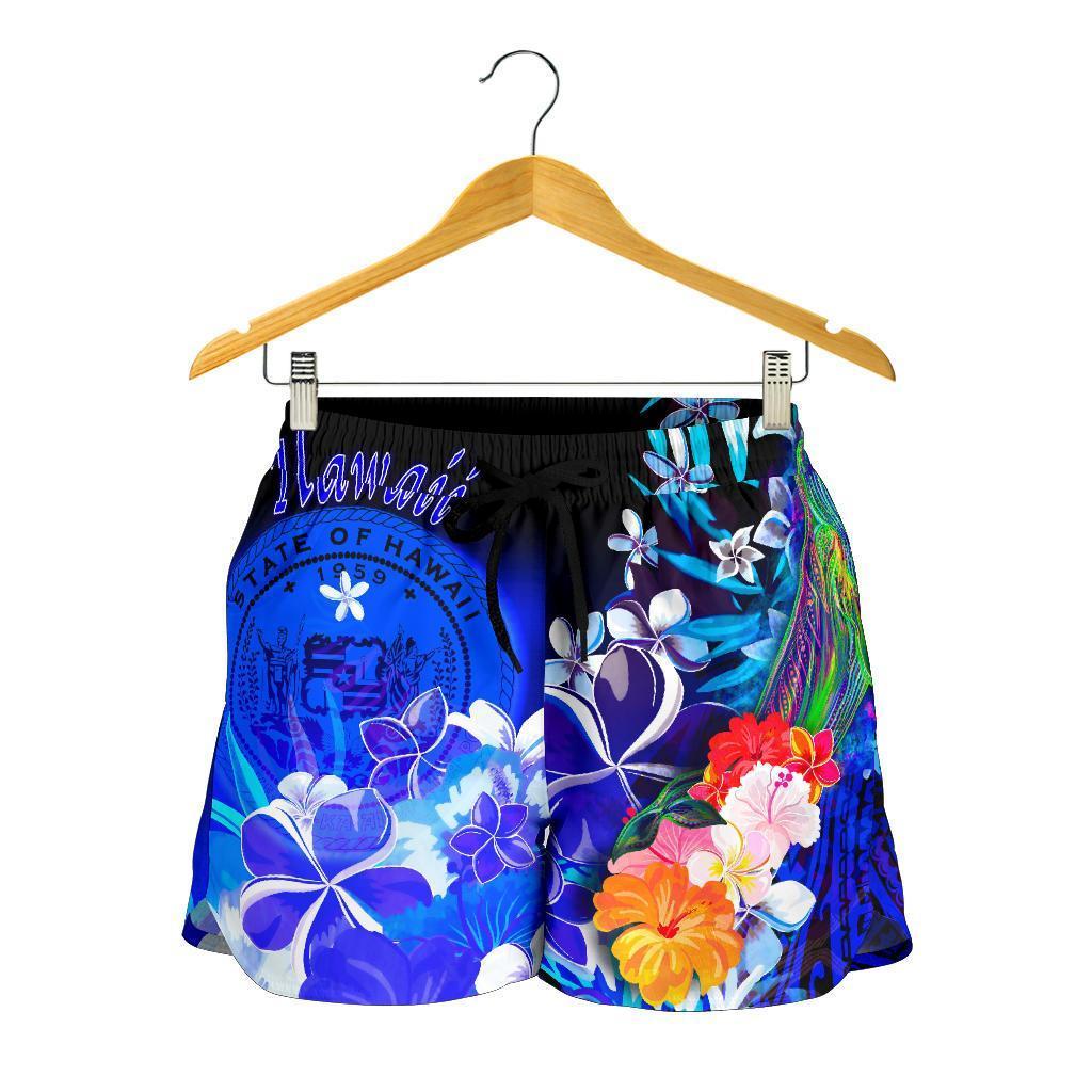 Blue printed shorts on hanger, black waistband with tropical flower and whale graphics