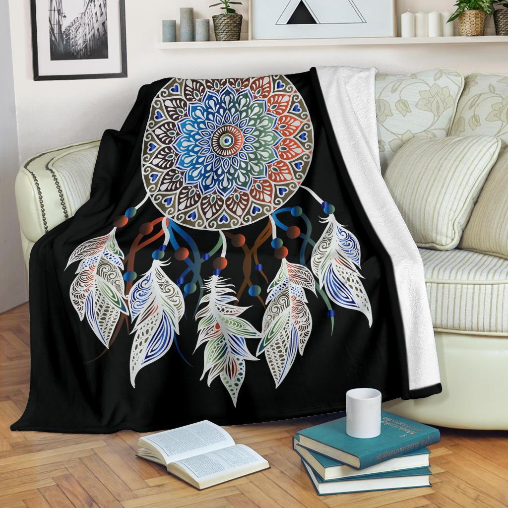 Black dreamcatcher blanket with multicolor mandala circle, blue beads, and white feather details
