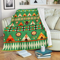 Green patterned blanket with tents, bison, and dreamcatcher circles, bordered edges