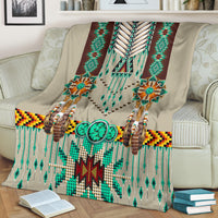Breastplate blanket with turquoise fringe, braided tassels, and geometric border bands