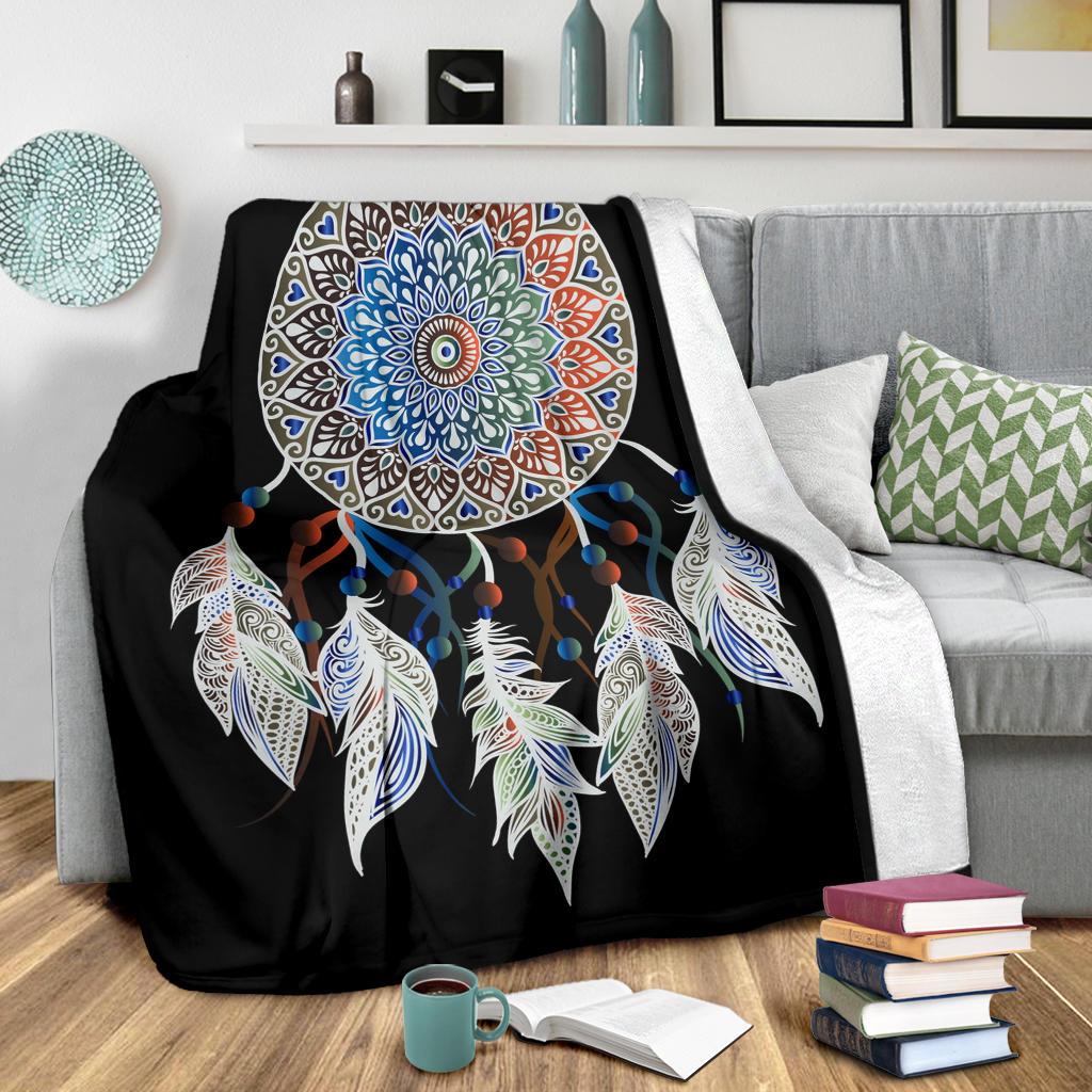 Black blanket featuring rainbow mandala center with hanging feathers and bead accents