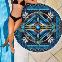 Blue circular beach blanket with star-and-tribal style mandala center and white fringe