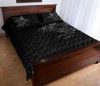Black quilt and pillow set with diamond quilt stitching and rune symbols, raven feather accents
