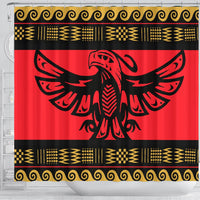 Front view red shower curtain with centered black bird emblem and gold scroll border