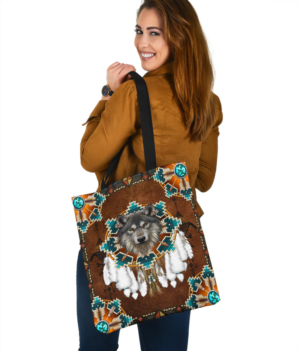 Large tote bag with wolf and feather-style details, turquoise geometric border, black handles