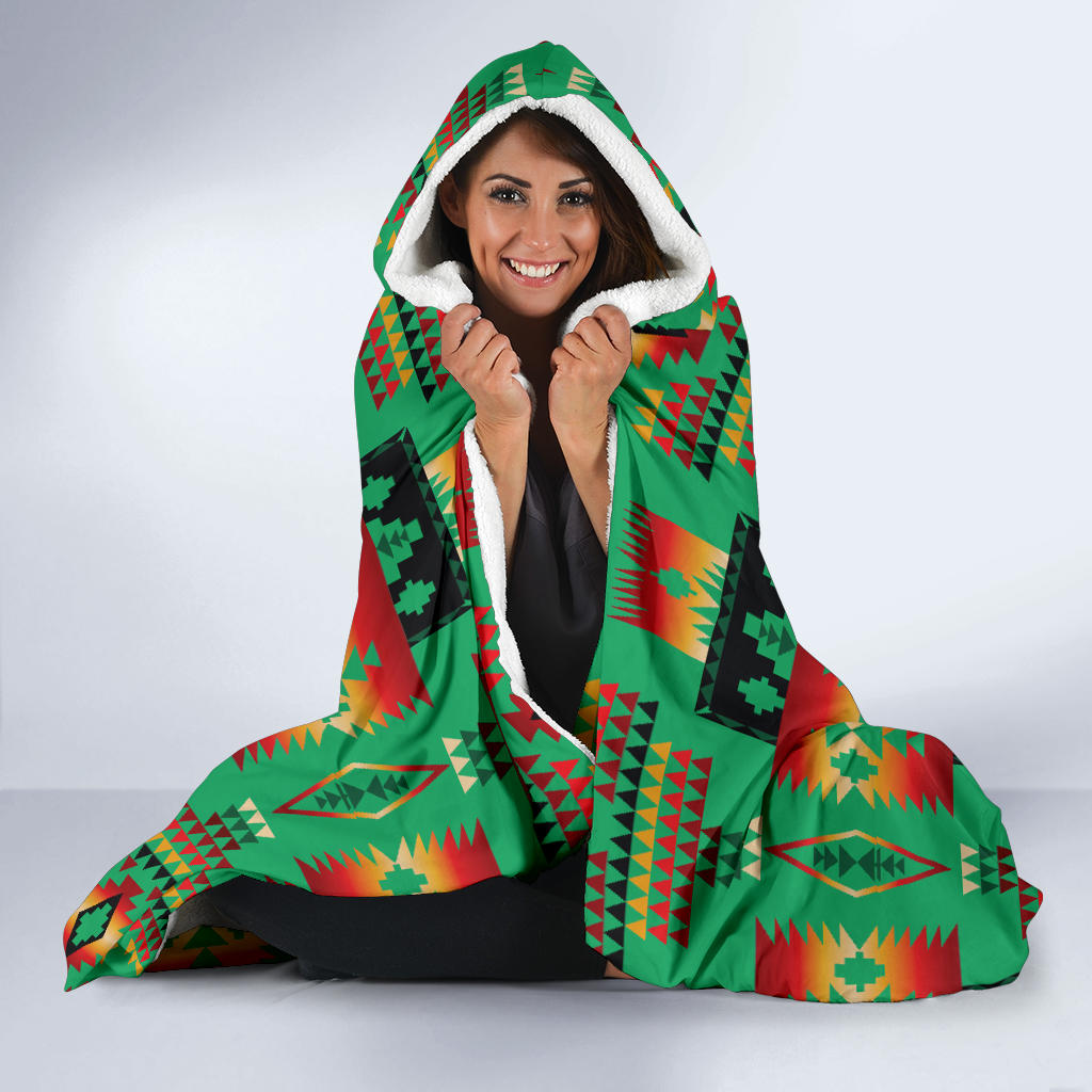 Hooded blanket with green and multicolor Native American pattern; white sherpa-lined hood
