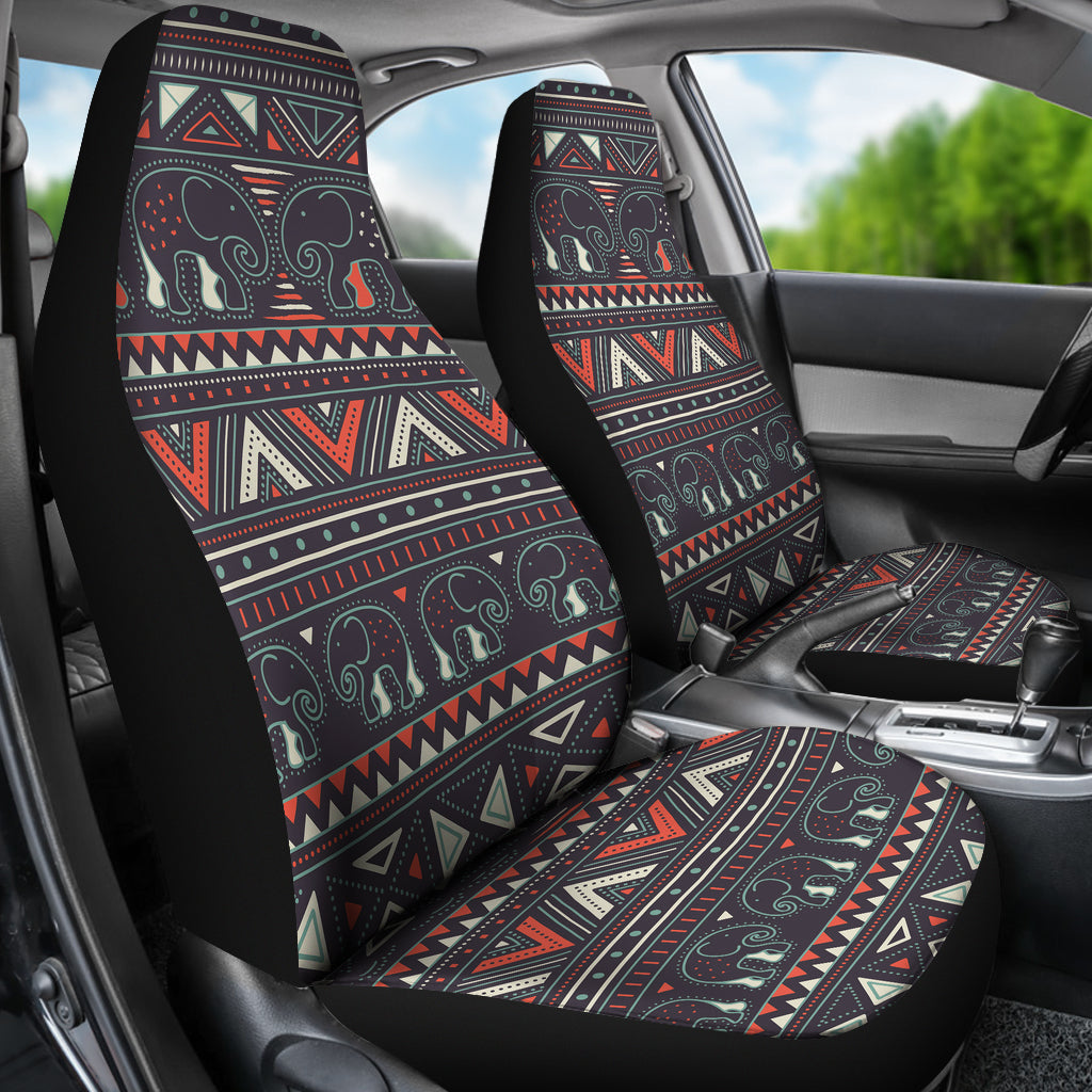 Two car seat covers installed: tribal elephant print with red, cream, and teal lines