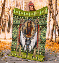 Green multicolor chief blanket held outdoors; geometric banding and portrait design