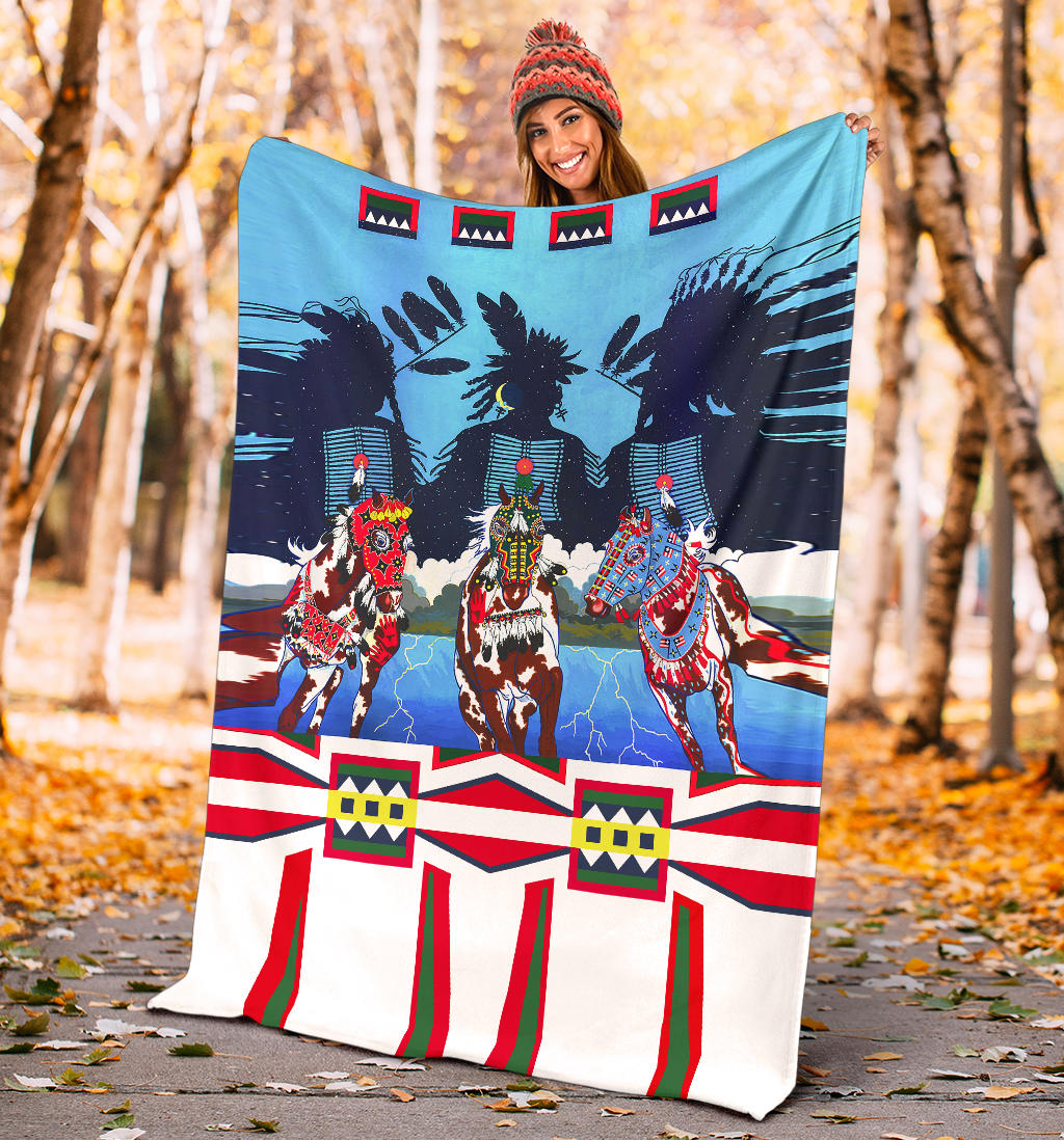 Horse costume blanket held outdoors, three costumed horses on blue with red/white/green stripes