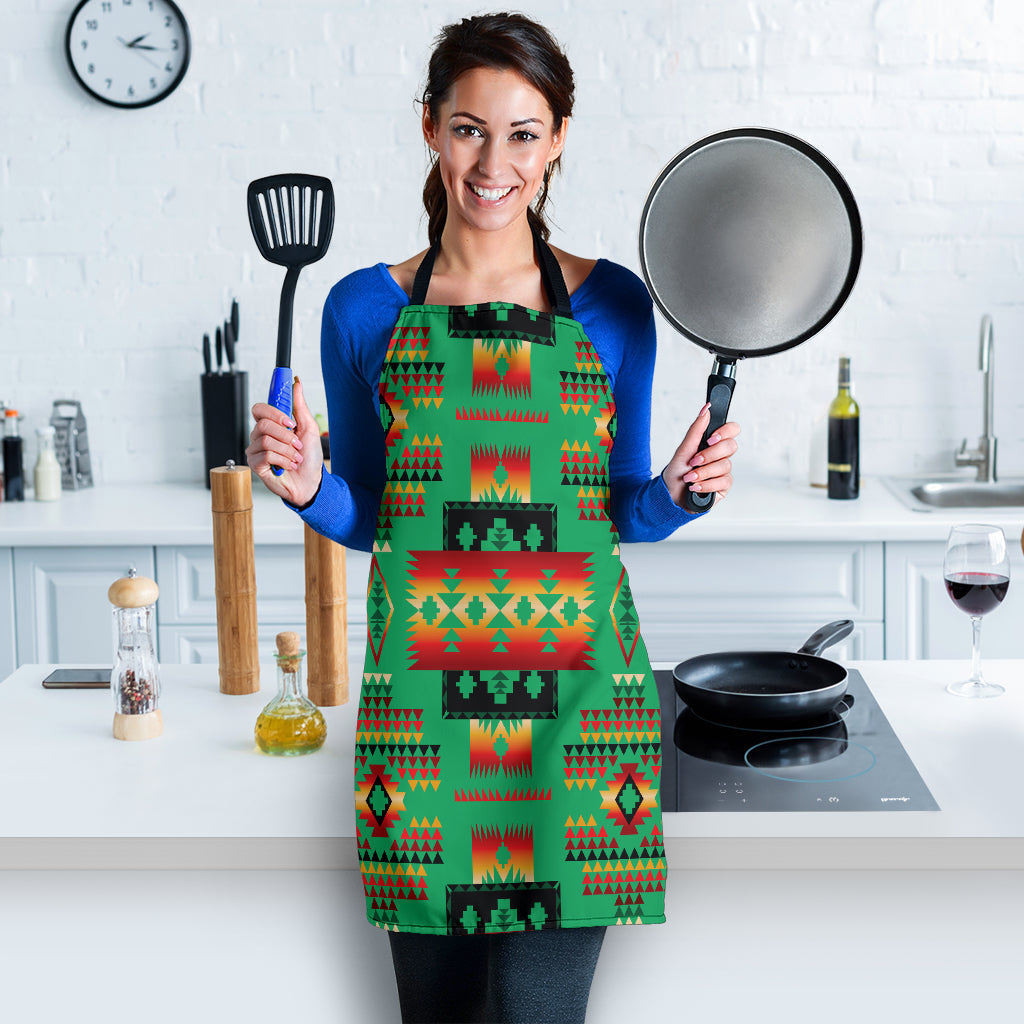 Green multicolor geometric apron held by model, full front view with bib pocket