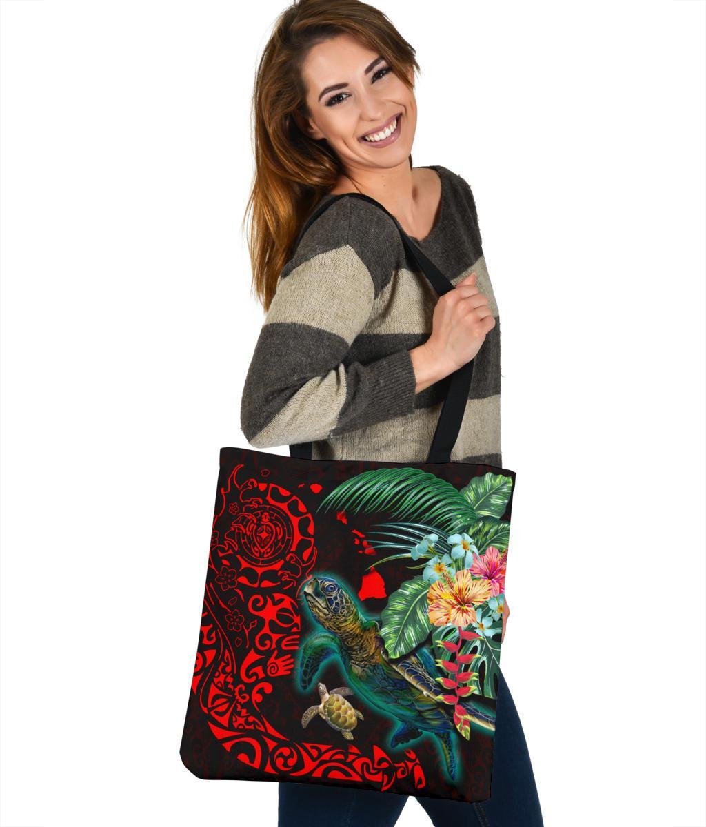 Large black shopper tote with teal turtle, red patterns, hibiscus and greenery graphic.
