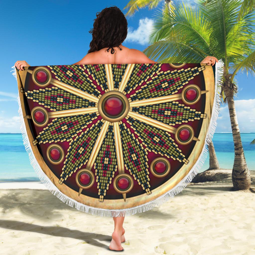 Round mandala beach blanket held up, dark maroon with multicolor bead rays and tassel fringe