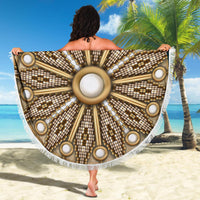 Grey mandala beach blanket spread out, central circular medallion with white fringe