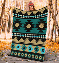 Teal Aztec pattern blanket with black, tan, and light-blue diamond and stripe bands