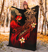 Black outdoor blanket showing red plumeria flowers, palm trees, and “Hawaii” stripe design