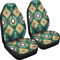 Two turquoise patterned seat covers with zigzag diamonds on black edging
