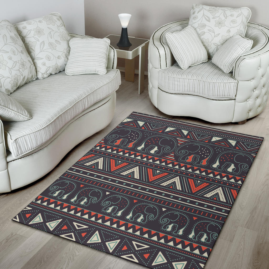 Dark tribal elephant area rug with multicolor horizontal bands and geometric border