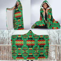 Draped hooded blanket with multicolor Native American geometric pattern, held open