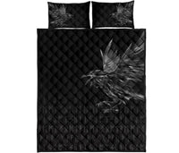 Front view: black quilt cover with raven feather design and rune symbols; matching pillowcases