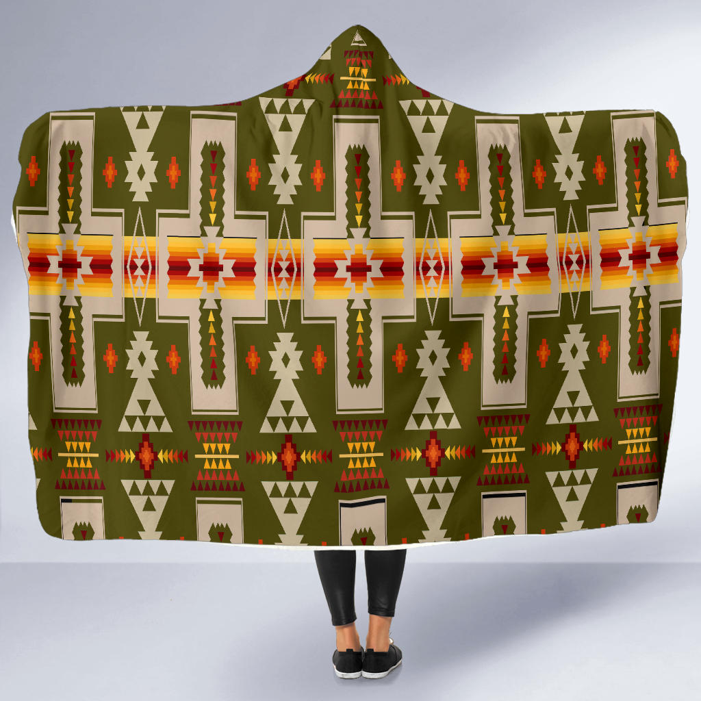 Olive hooded blanket draped over legs, multicolor geometric pattern across the back