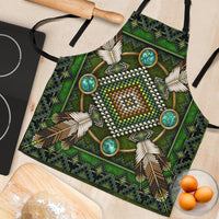 Green mandala apron close-up: beaded heart motif with turquoise circles and feather trim