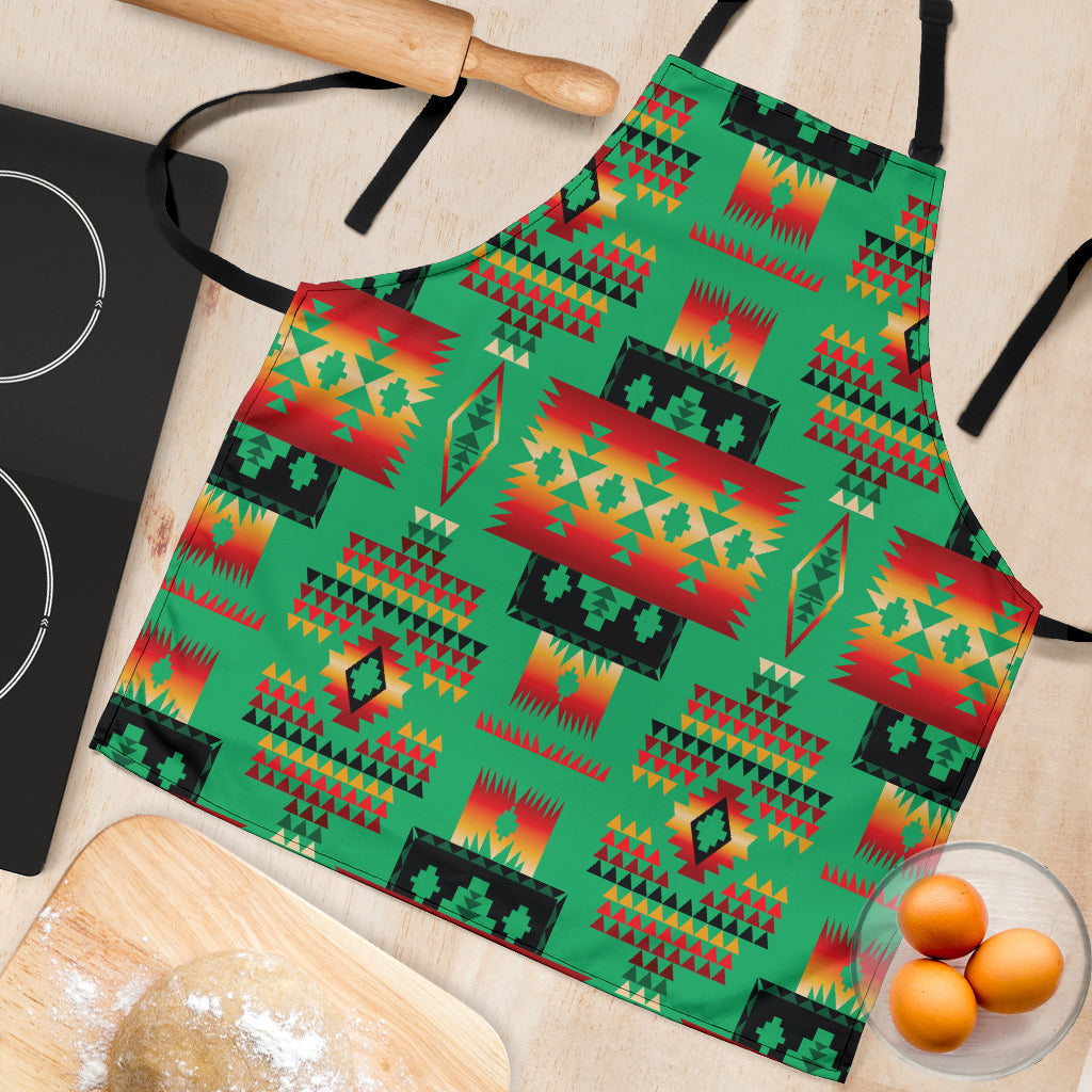 Close-up of green multicolor Native geometric apron print with red, teal, and yellow shapes