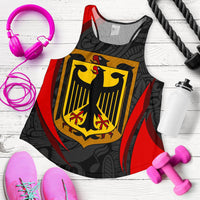 Black racerback tank laid flat with bold yellow crest shield and red side panels