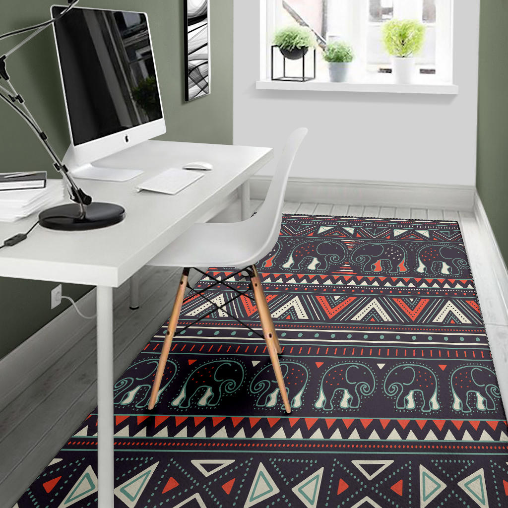 Tribal elephant area rug, dark base with red, cream, and teal pattern bands
