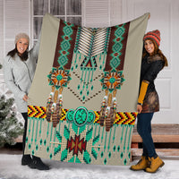 Breastplate blanket held on front steps; turquoise bead fringes and geometric band