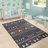 Kids-room area rug featuring tribal elephant motif on dark background with multicolor stripes