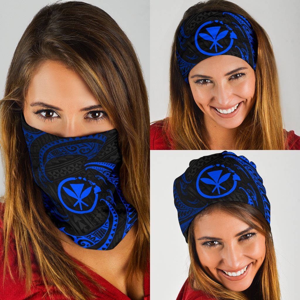 Blue tribal wave bandana with black geometric swirls and sun emblem, worn over face