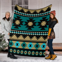 Teal Aztec blanket with black stripes, tan triangles, and turquoise border icons