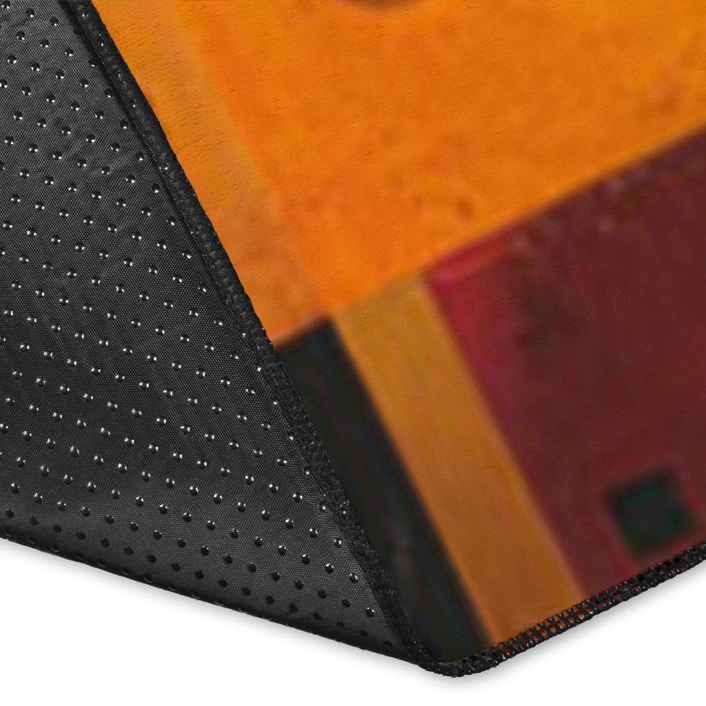 Rug corner close-up: horse graphic edge with black textured backing and dotted trim
